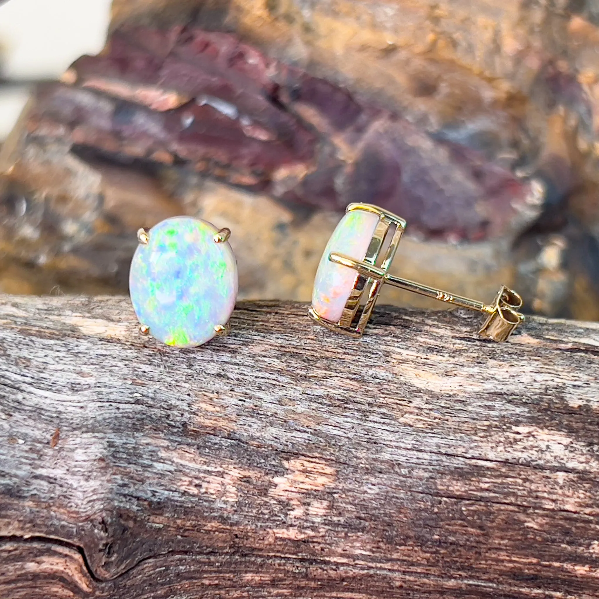 14kt Yellow Gold pair of black opal 2.53ct claw set earrings