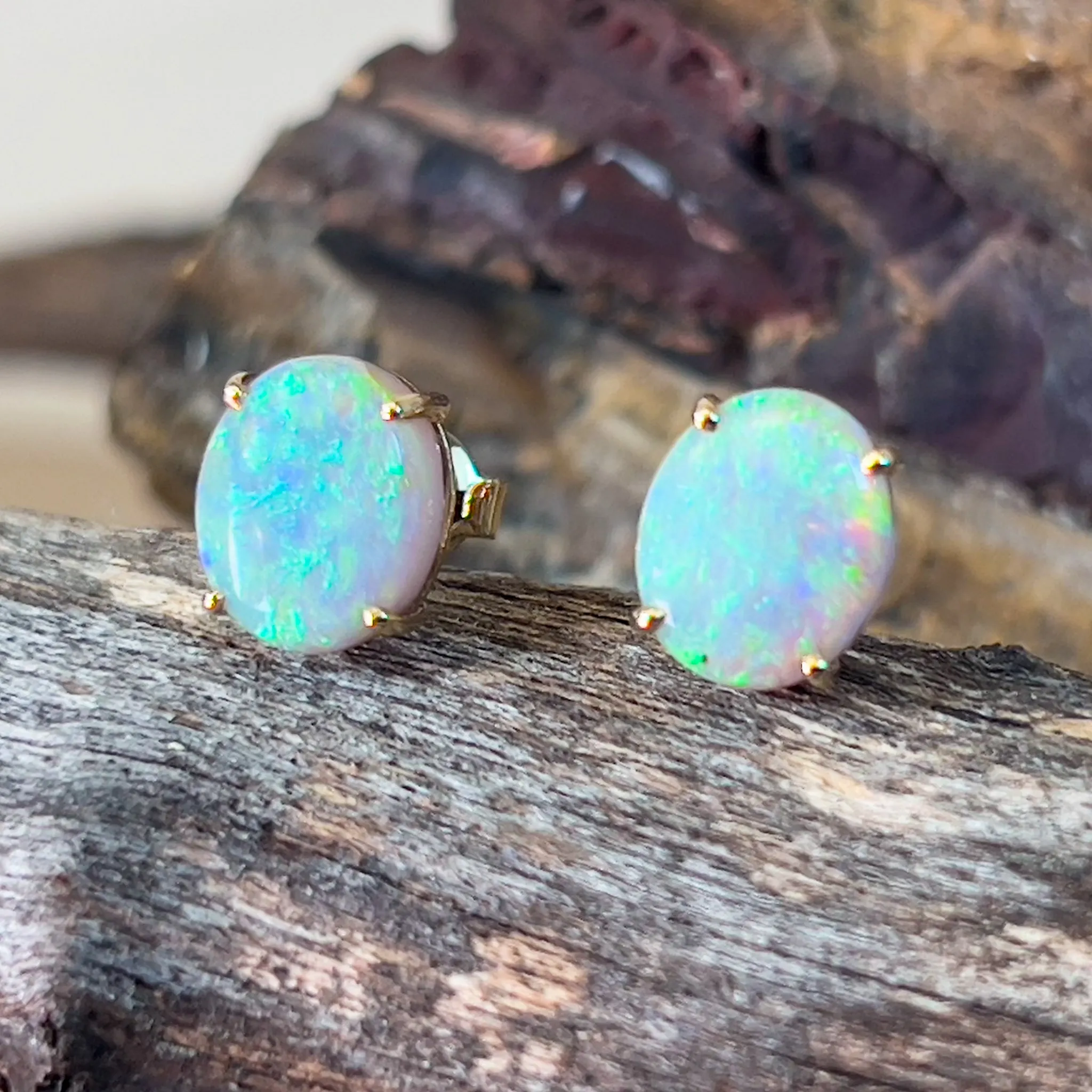 14kt Yellow Gold pair of black opal 2.53ct claw set earrings