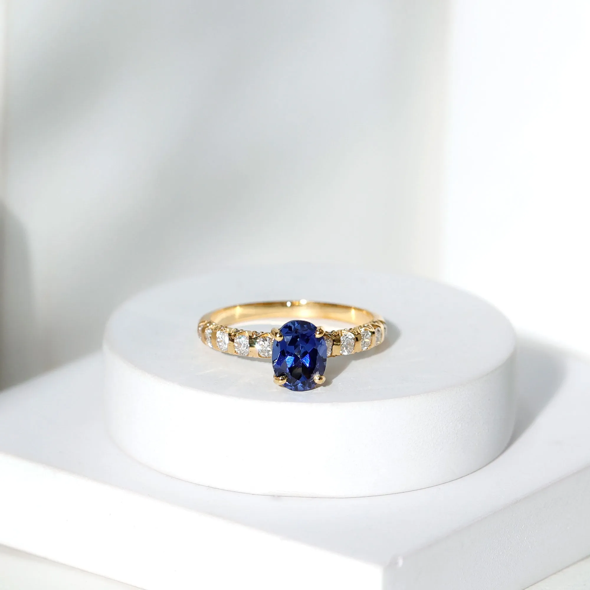 2.25 CT Oval Cut Created Blue Sapphire Solitaire and Diamond Side Stones