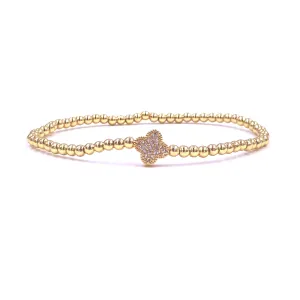 Ashley Gold Stainless Steel Gold Plated Center CZ Encrusted Flower Design Stretch Beaded Bracelet