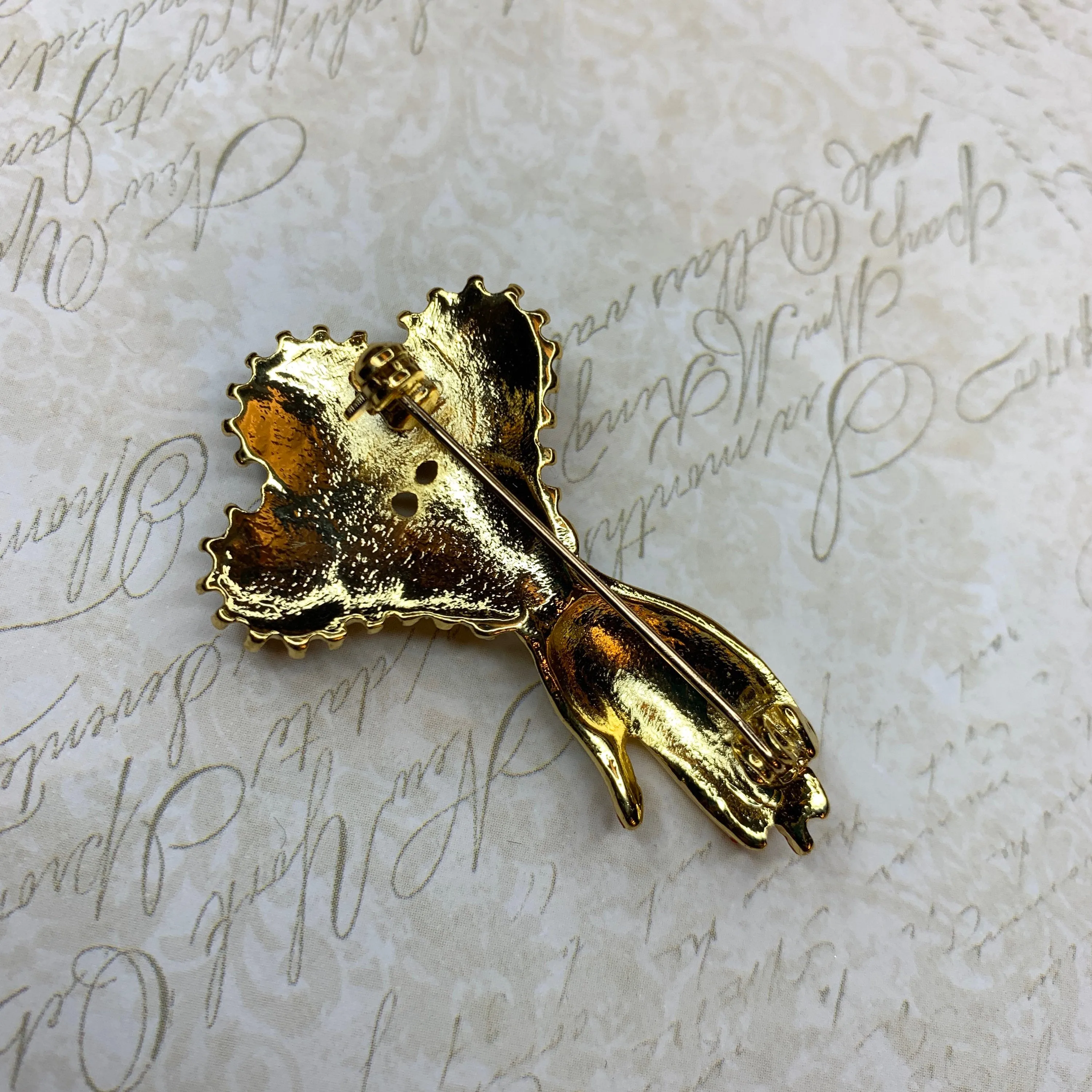 Hand with pearls brooch
