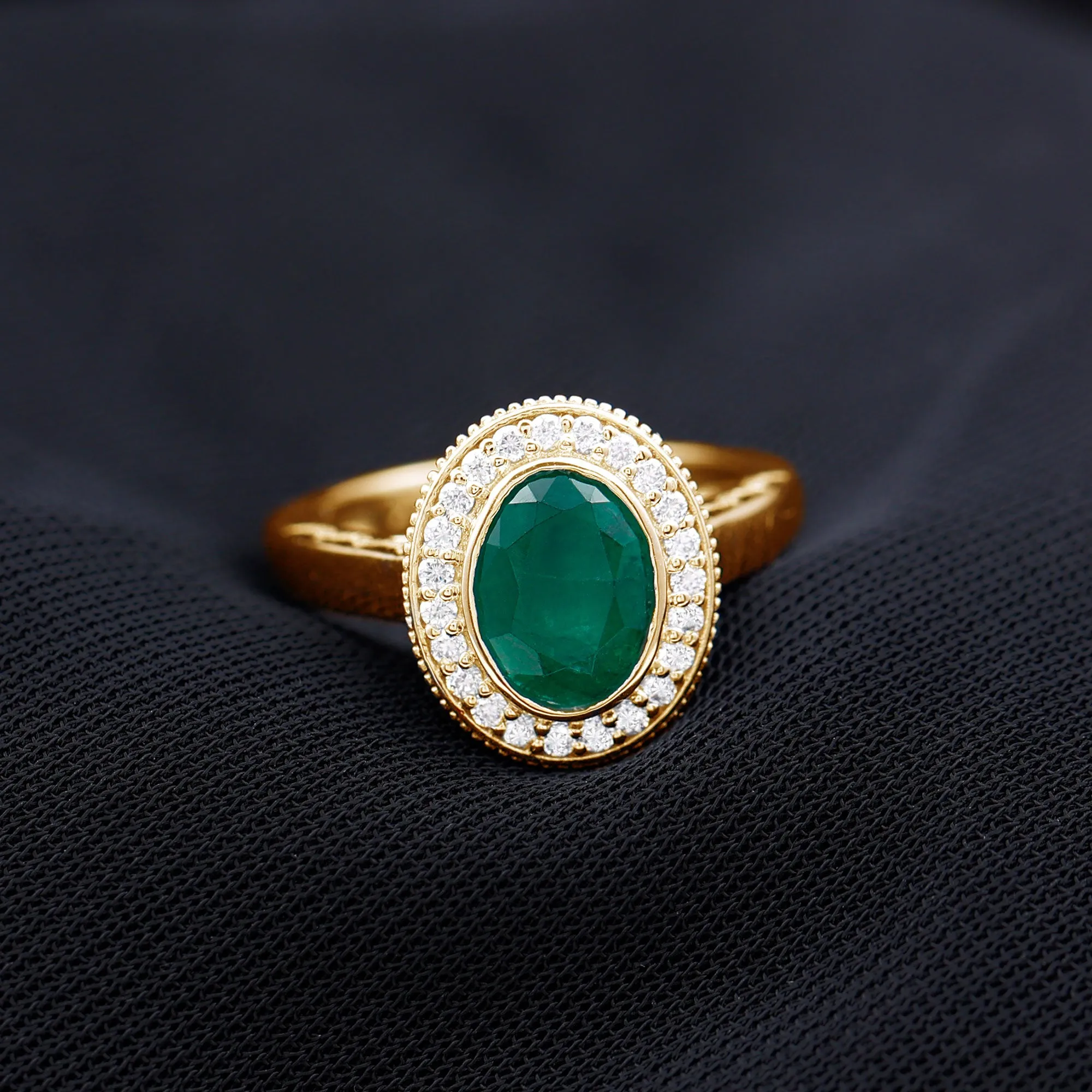 Oval Lab Grown Emerald and Diamond Halo Engagement Ring