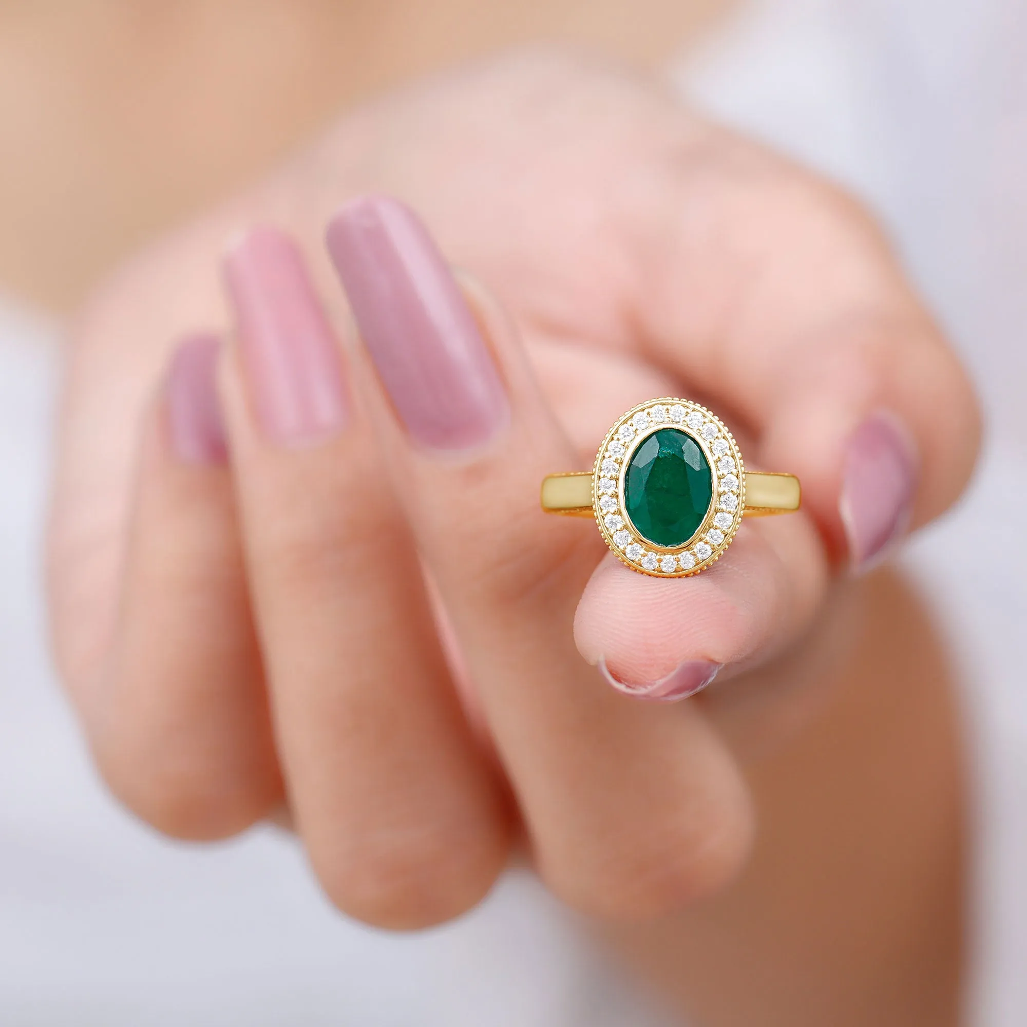 Oval Lab Grown Emerald and Diamond Halo Engagement Ring
