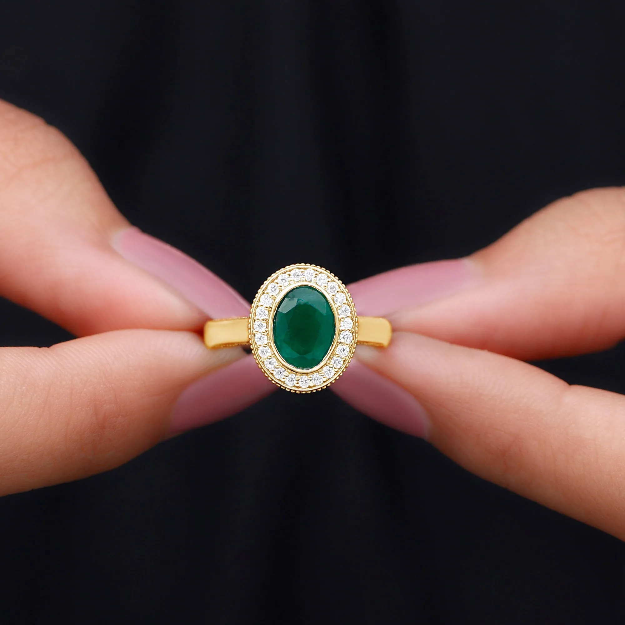 Oval Lab Grown Emerald and Diamond Halo Engagement Ring