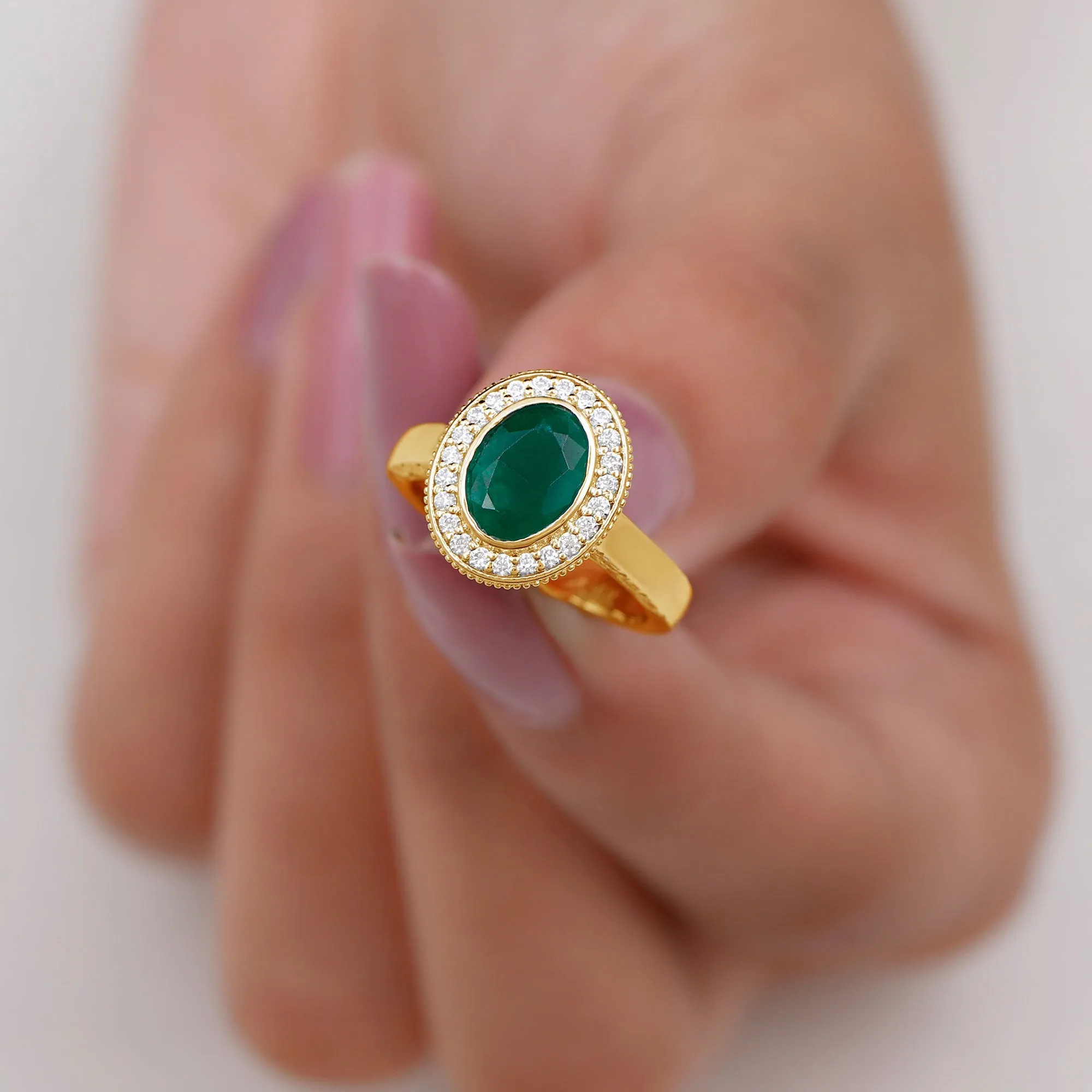 Oval Lab Grown Emerald and Diamond Halo Engagement Ring