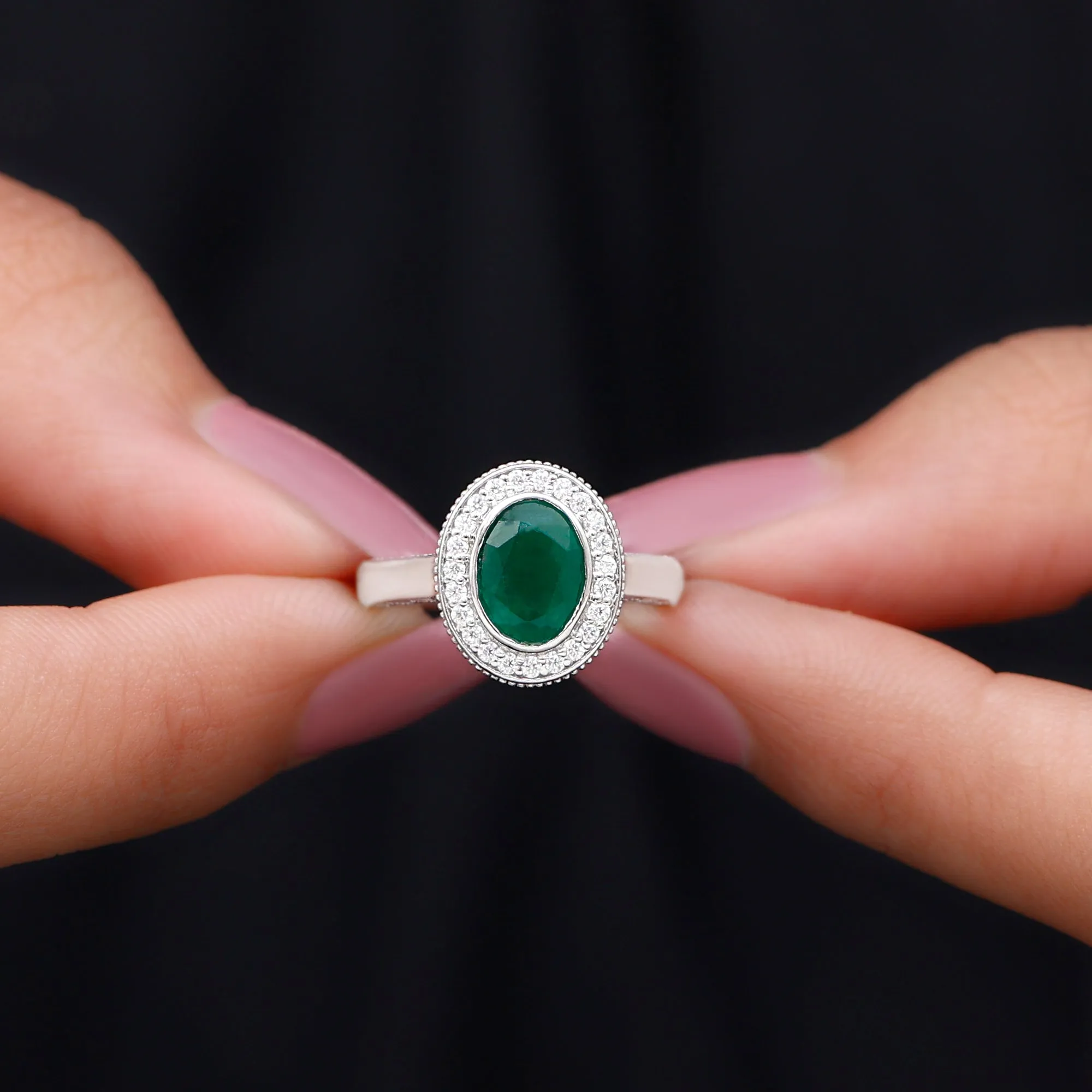 Oval Lab Grown Emerald and Diamond Halo Engagement Ring