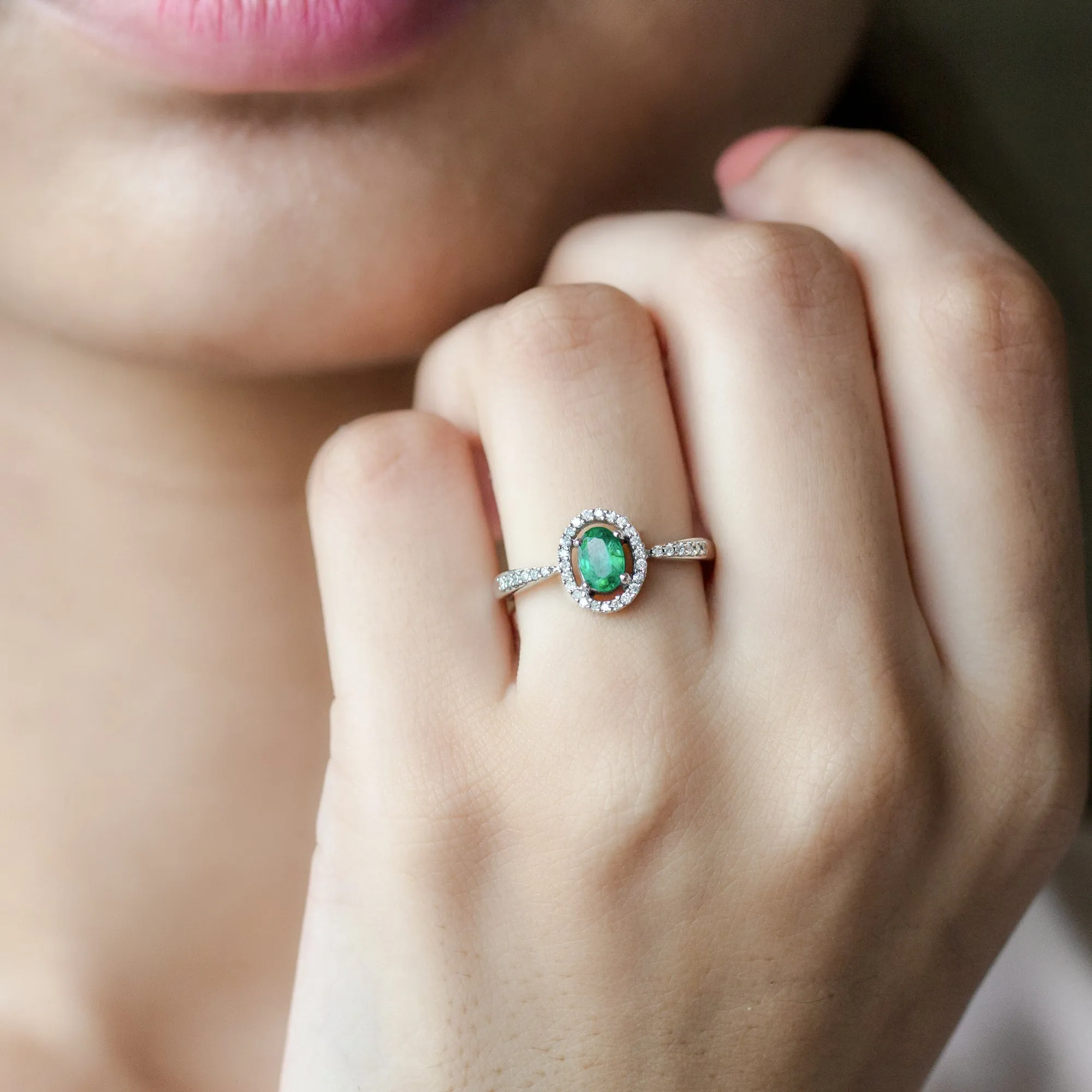 Oval shape Emerald and Diamond Halo Engagement Ring