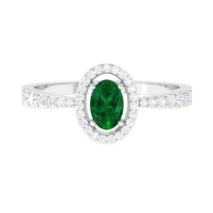 Oval shape Emerald and Diamond Halo Engagement Ring