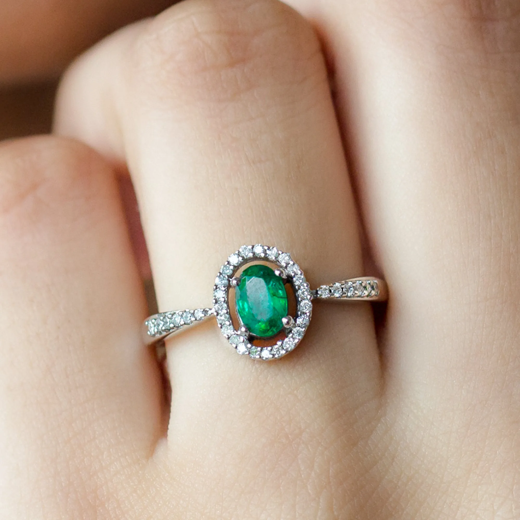 Oval shape Emerald and Diamond Halo Engagement Ring