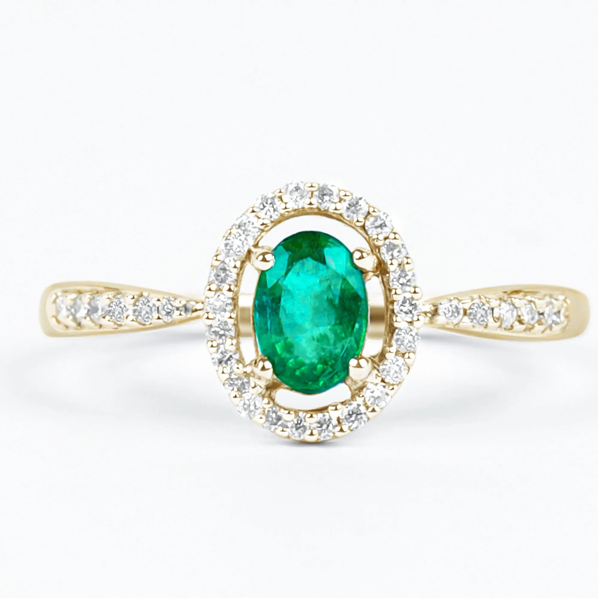 Oval shape Emerald and Diamond Halo Engagement Ring
