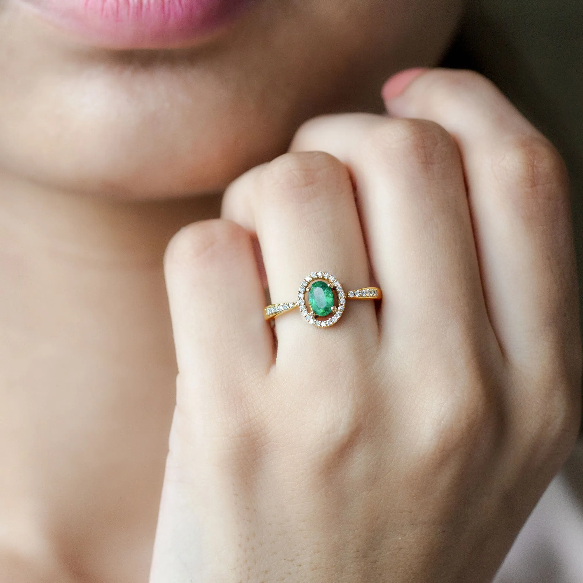 Oval shape Emerald and Diamond Halo Engagement Ring