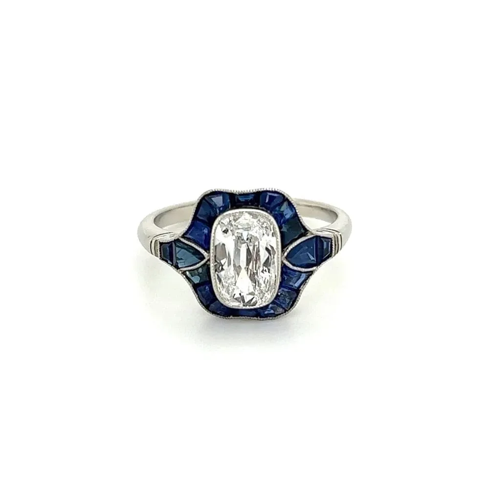 Platinum Ring With Old Miner Cut Cushion Diamond and Sapphires at Regard Jewelry in Austin, Texas