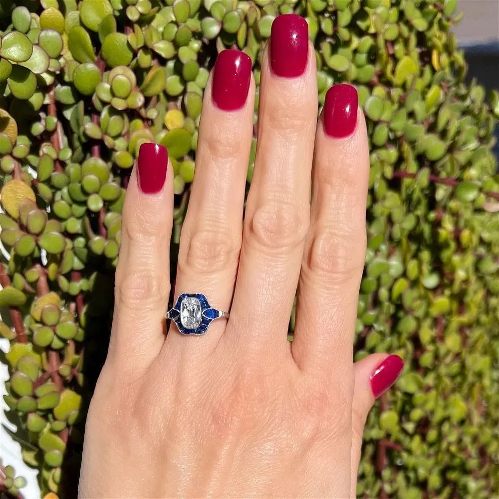 Platinum Ring With Old Miner Cut Cushion Diamond and Sapphires at Regard Jewelry in Austin, Texas