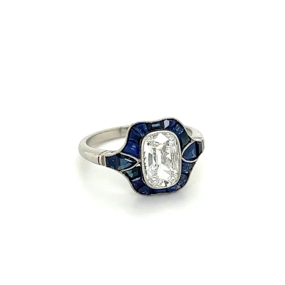 Platinum Ring With Old Miner Cut Cushion Diamond and Sapphires at Regard Jewelry in Austin, Texas