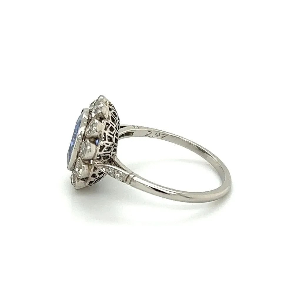 Platinum Ring With Oval Sapphire and Diamond Halo at Regard Jewelry in Austin, Texas