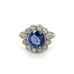 Platinum Ring With Oval Sapphire and Diamond Halo at Regard Jewelry in Austin, Texas