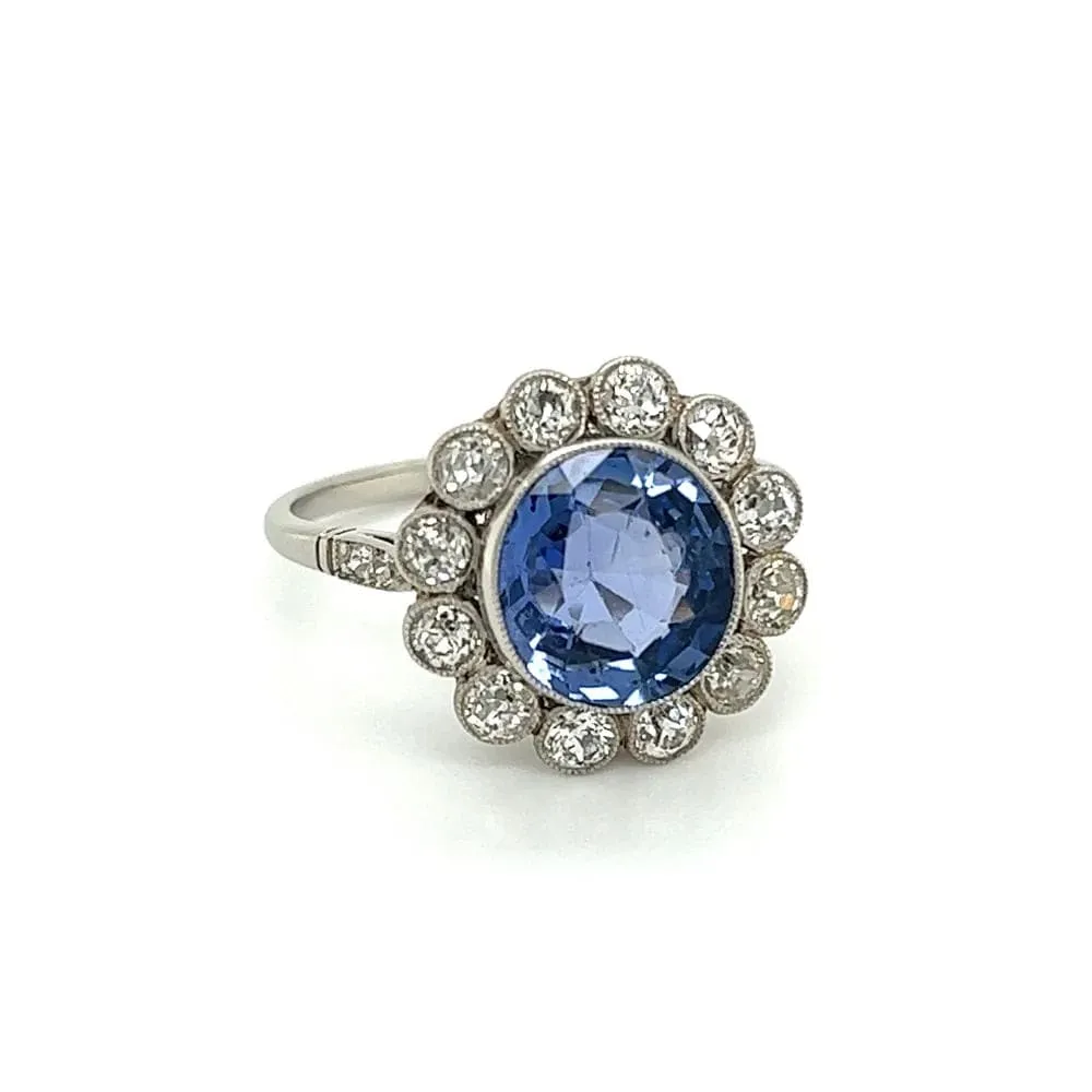 Platinum Ring With Oval Sapphire and Diamond Halo at Regard Jewelry in Austin, Texas