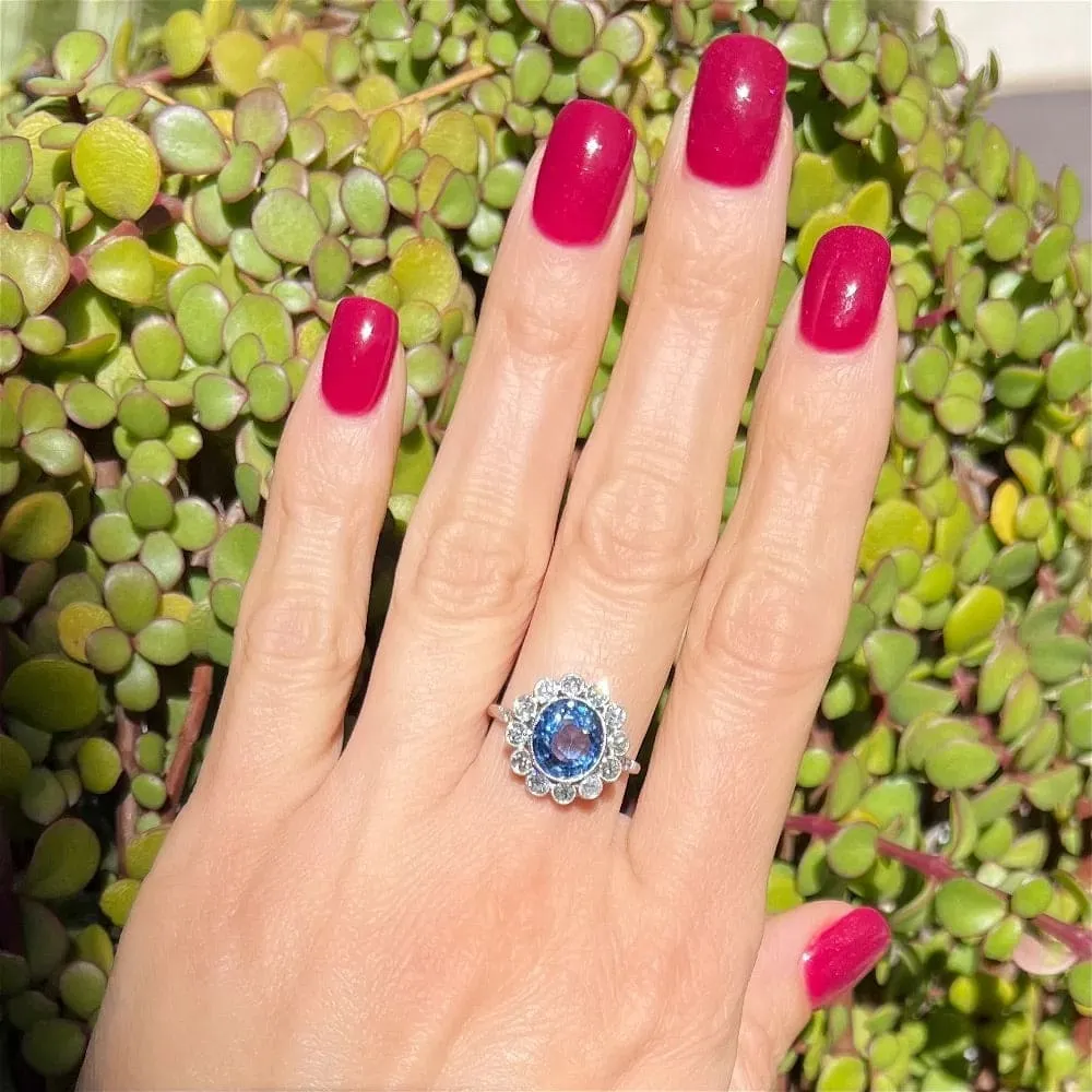 Platinum Ring With Oval Sapphire and Diamond Halo at Regard Jewelry in Austin, Texas