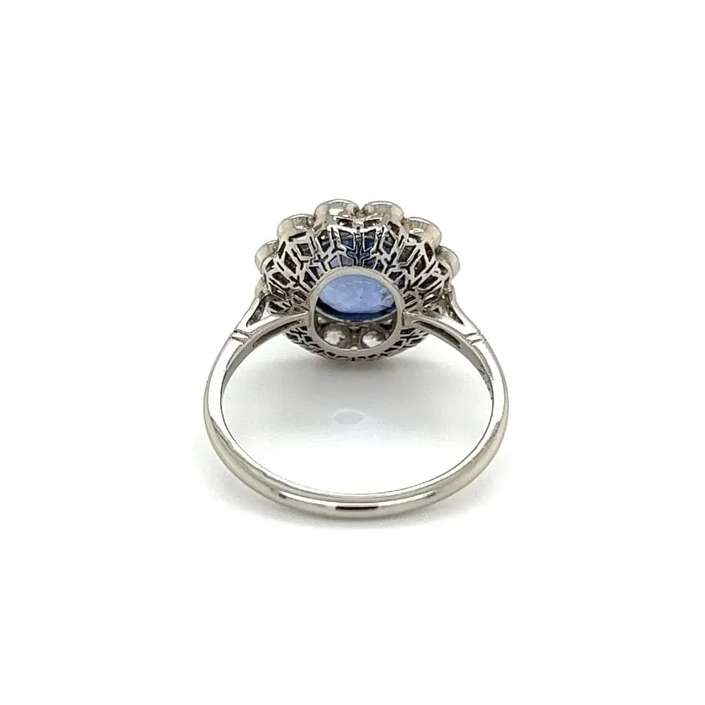 Platinum Ring With Oval Sapphire and Diamond Halo at Regard Jewelry in Austin, Texas