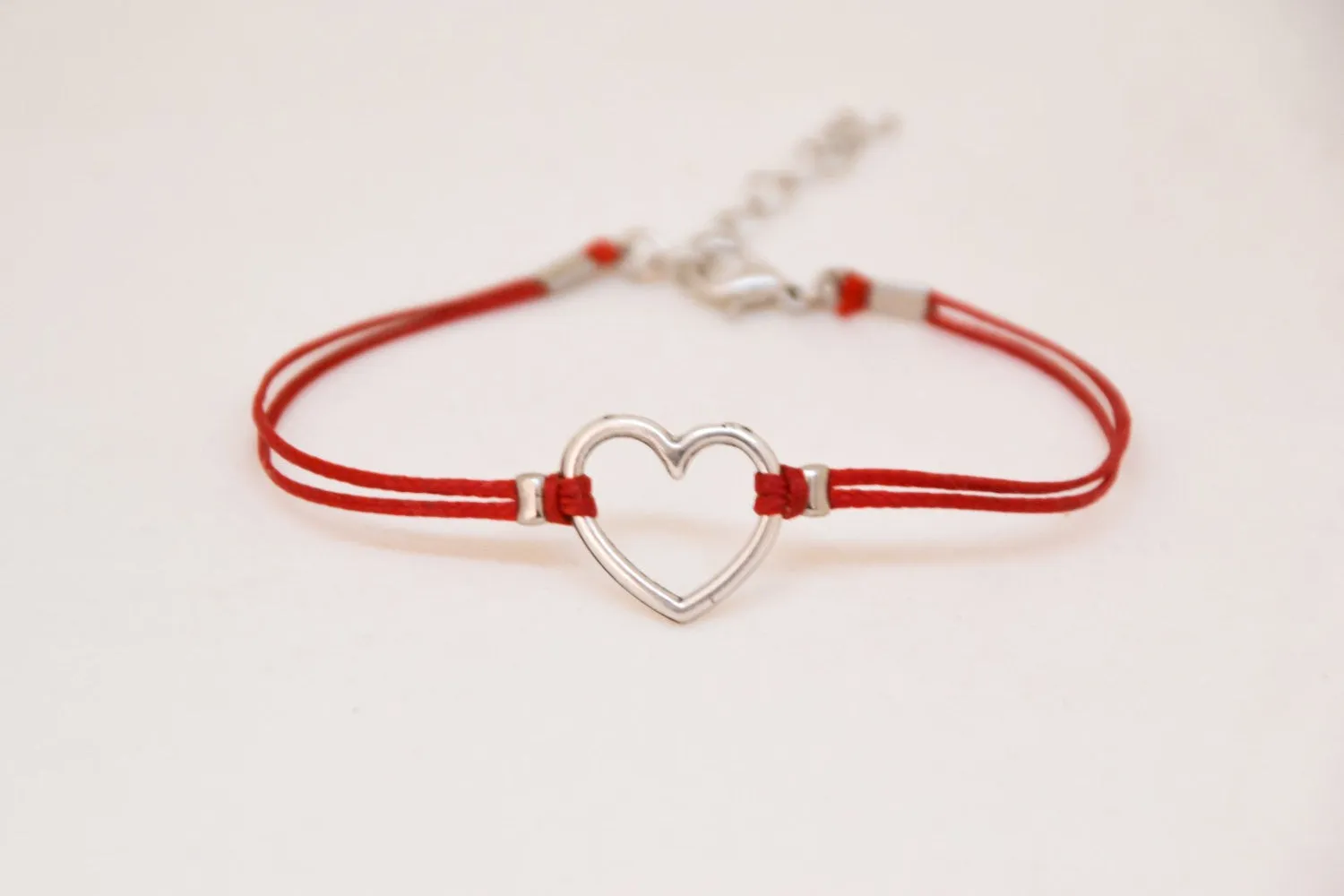 Red bracelet with silver heart charm, adjustable bracelet