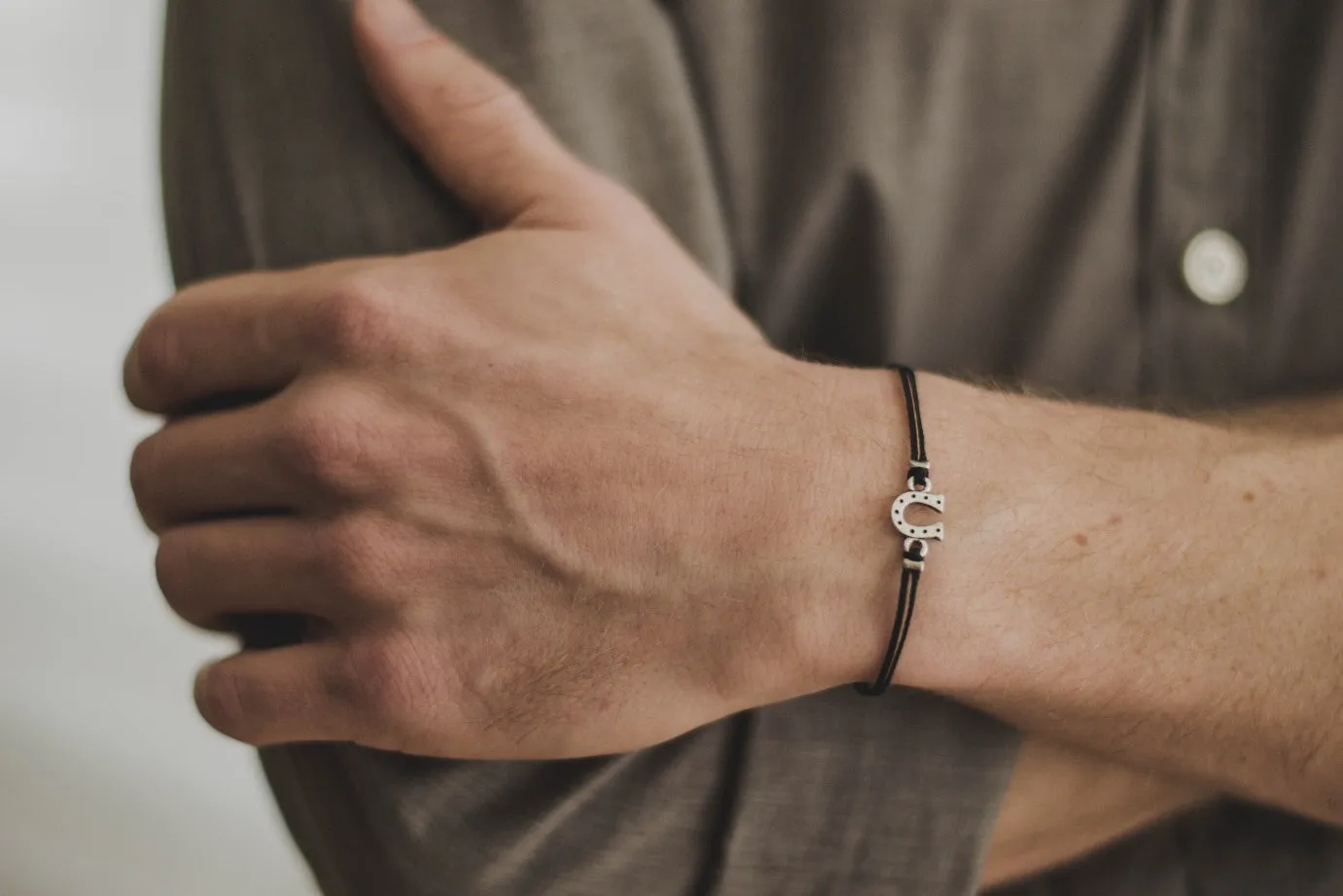 Silver Horseshoe bracelet for men, black cords
