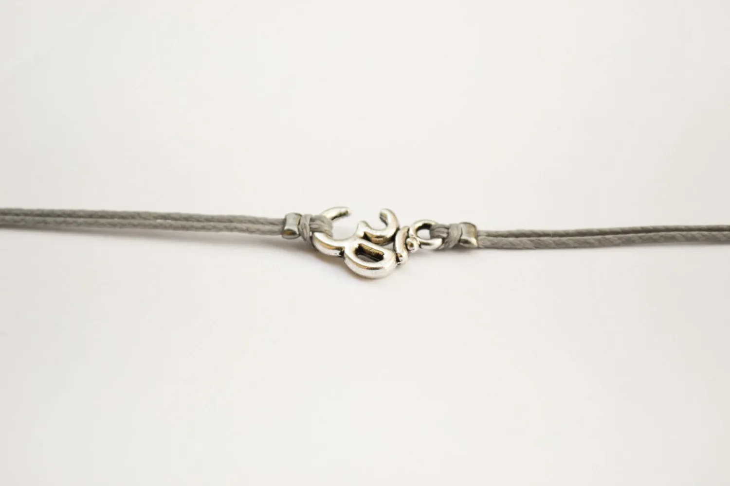 Silver Om charm bracelet for men, gray cord, yoga jewelry, gift for him
