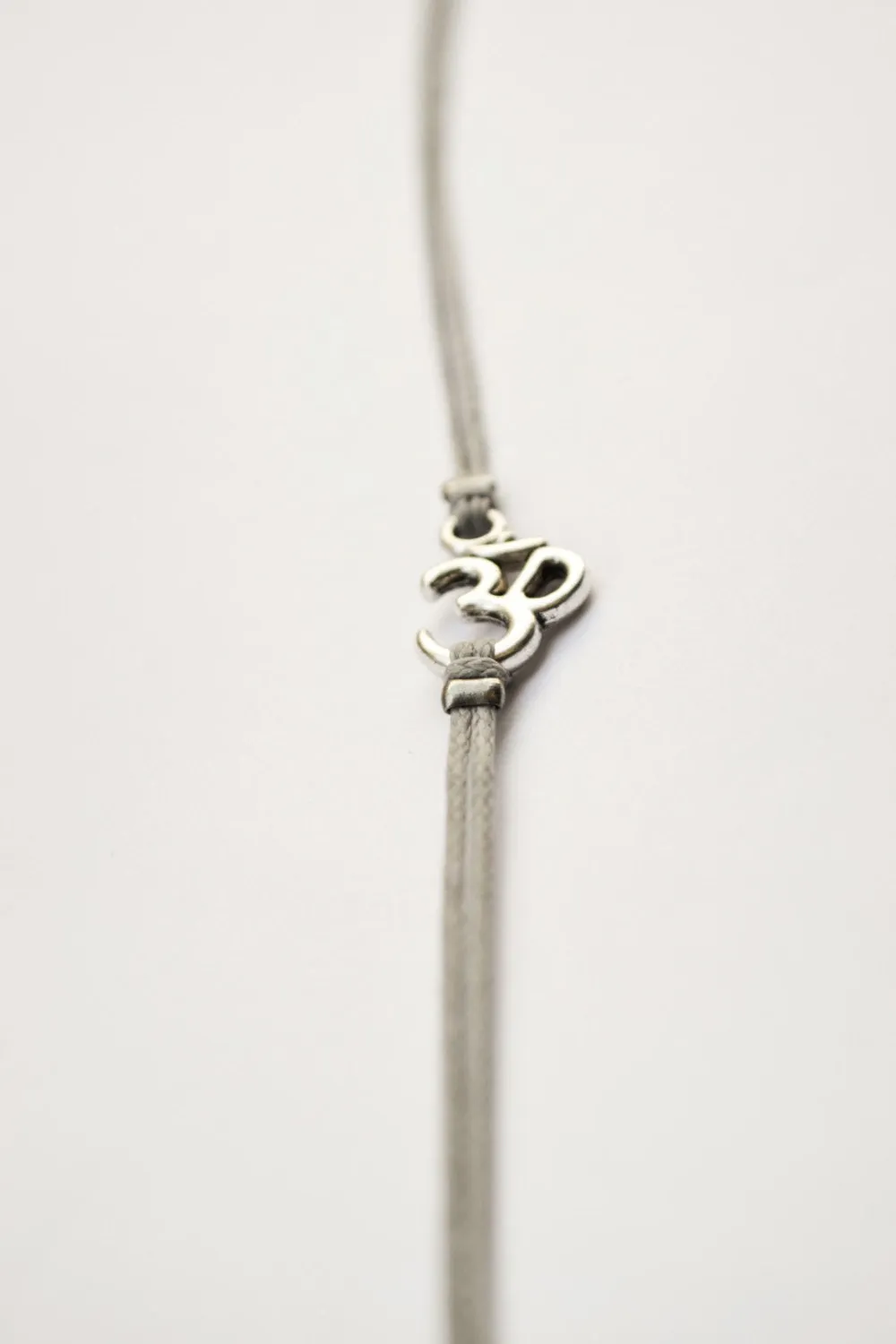 Silver Om charm bracelet for men, gray cord, yoga jewelry, gift for him